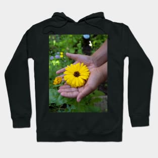 Kid holding a yellow flower in his hand Hoodie